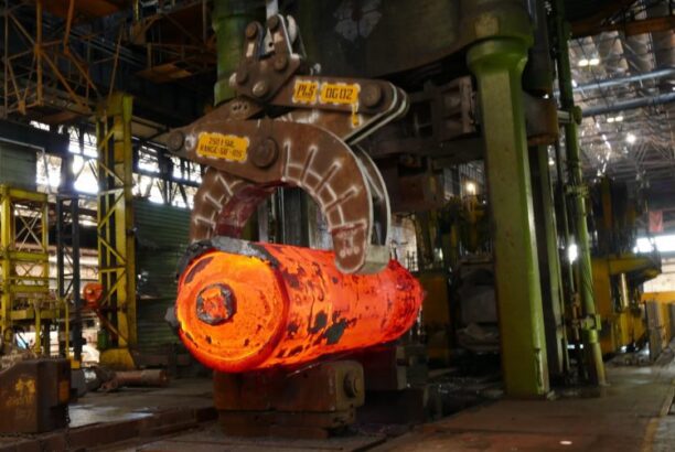 Crane carries molten steel in forge